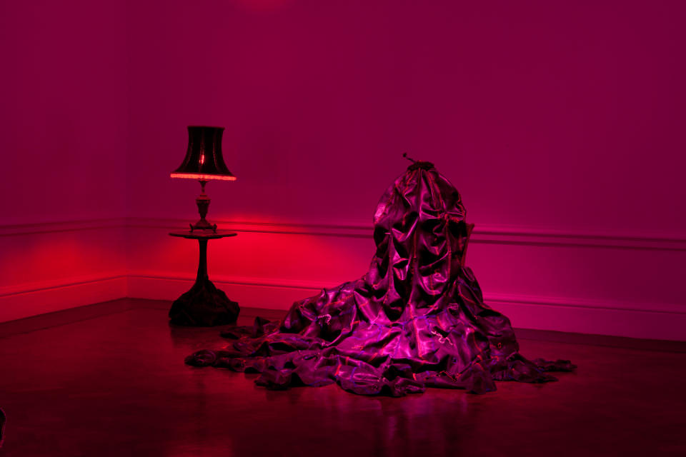 This undated image released by Nicholas Hlobo and Stevenson shows the art piece ”Kubomvu (2009),” made from a found table, found lamp, rubber inner tube, ribbon and red light bulb. The work will appear as part of South African artist Nicholas Hlobo's new installation “Intethe (Sketch for an Opera)” at Locust Projects in Miami during Art Basel Miami Beach, Dec. 5-8. (AP Photo/Nicholas Hlobo and Stevenson)