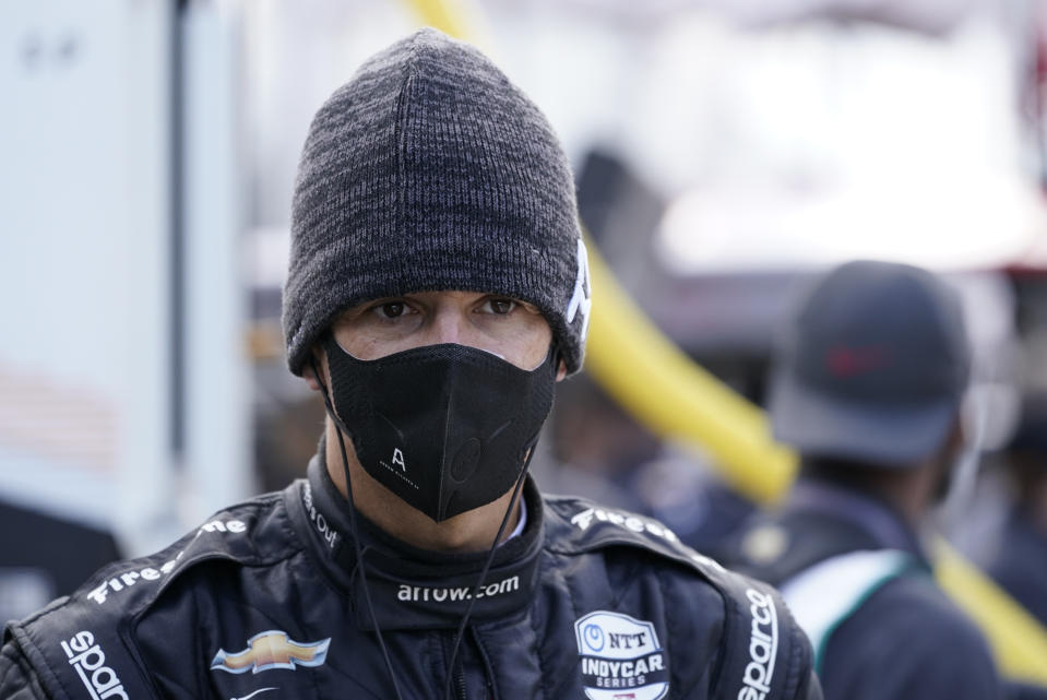 Helio Castroneves, of Brazil, waits in the pits during a practice session for the IndyCar auto race at Indianapolis Motor Speedway, Thursday, Oct. 1, 2020, in Indianapolis. (AP Photo/Darron Cummings)