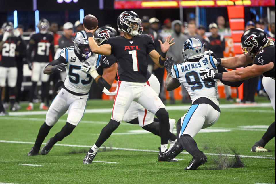 Atlanta Falcons quarterback Marcus Mariota throws during the first half of an NFL football game against the Carolina Panthers Sunday, Oct. 30, 2022, in Atlanta. (AP Photo/John Amis)