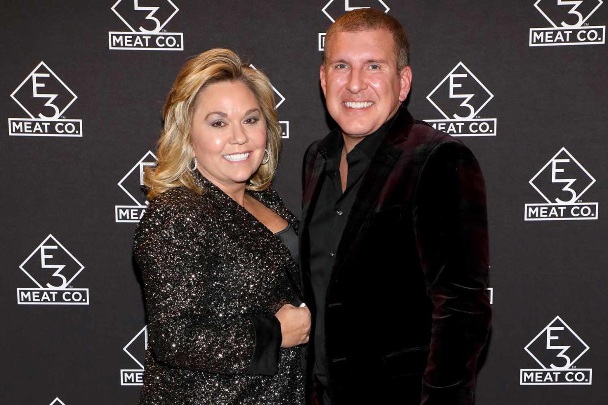 NASHVILLE, TENNESSEE - NOVEMBER 20: Julie Chrisley (L) and Todd Chrisley attend the grand opening of E3 Chophouse Nashville on November 20, 2019 in Nashville, Tennessee. (Photo by Danielle Del Valle/Getty Images for E3 Chophouse Nashville)