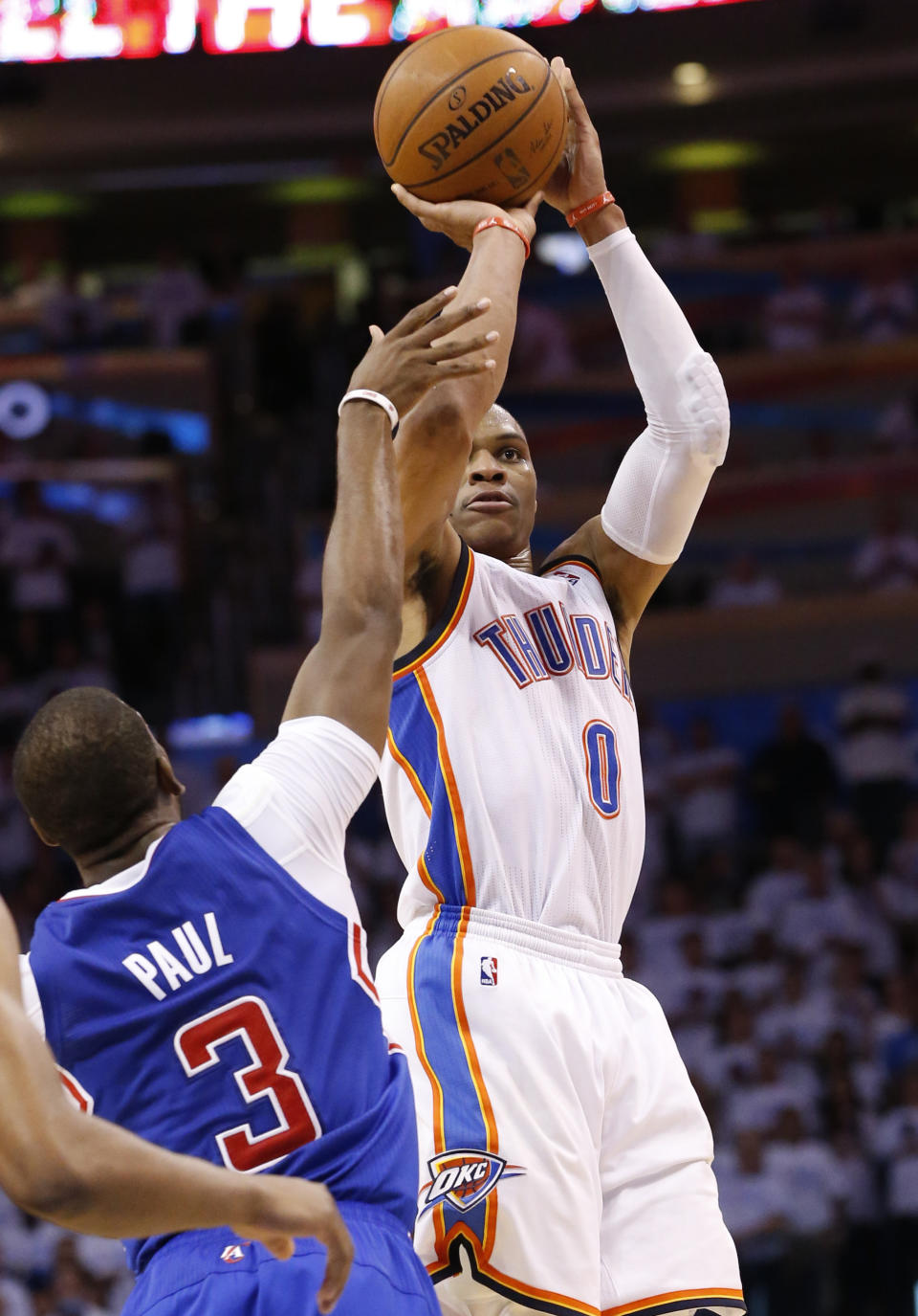 Oklahoma City Thunder guard Russell Westbrook (0) shoots over Los Angeles Clippers guard Chris Paul (3) in the second half of Game 5 of the Western Conference semifinal NBA basketball playoff series in Oklahoma City, Tuesday, May 13, 2014. Oklahoma City won 105-104. (AP Photo)