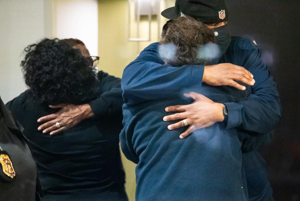 April 16, 2021: People hug after learning that their loved one is safe after a person shot and killed 8 people inside a FedEx building in Indianapolis.