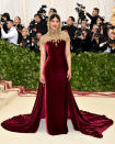 <p>Actress and former Miss World Priyanka Chopra stood out from the crowd in this stunning, burgundy Ralph Lauren dress with gold detailing. Photo: Getty Images </p>