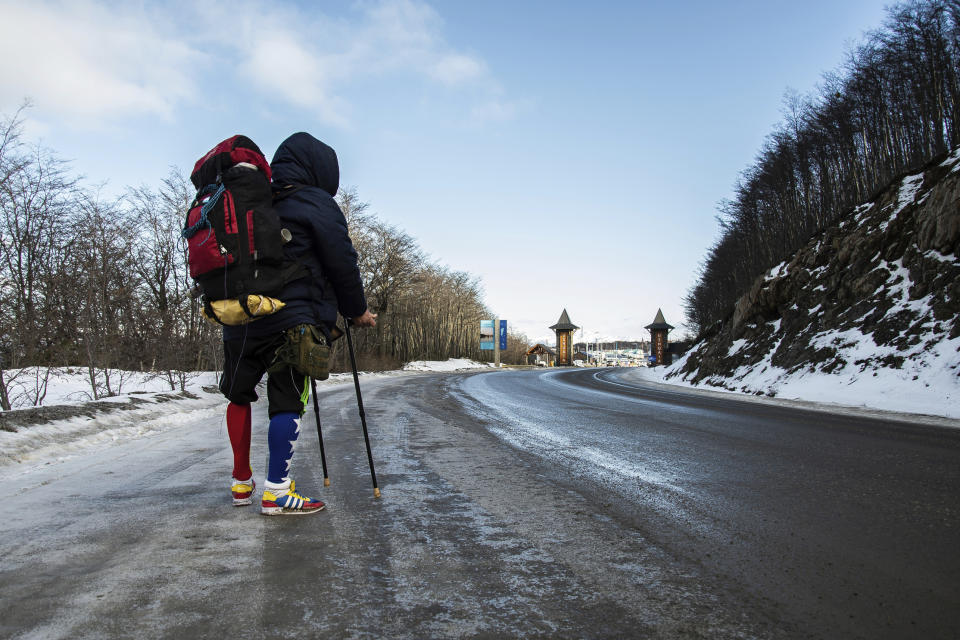 Venezuelan Yeslie Aranda, 57, stands at the entrance of Ushuaia, Argentina, the southernmost city in the world, as he makes good on his promise to travel throughout South America with one leg and a prosthesis, Saturday, Aug. 17, 2019. “I am living my dream,” Aranda said, as he headed toward a sign that welcomes visitors to ‘the end of the world.’ “My message to people is to pursue their own dreams, and conquer them as well.” (AP Photo/Luján Agusti)