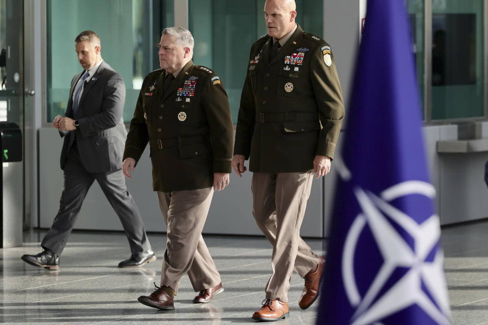 Chairman of the Joint Chiefs of Staff Gen. Mark Milley gestures as he arrives for a meeting of NATO defense ministers at NATO headquarters in Brussels, Wednesday, Oct. 12, 2022. (AP Photo/Olivier Matthys)