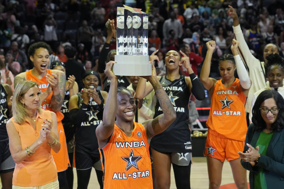 Seattle Storm's Jewell Loyd, of Team Stewart, holds up the MVP trophy after winning the award after a WNBA All-Star basketball game Saturday, July 15, 2023, in Las Vegas. (AP Photo/John Locher)