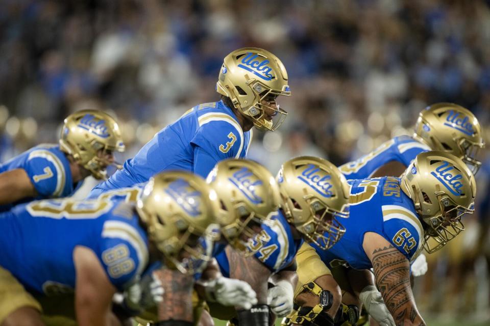 UCLA quarterback Dante Moore prepares to take a snap against Coastal Carolina on Saturday.