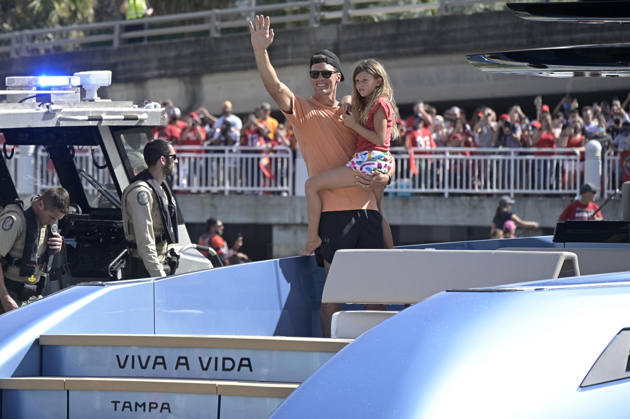 Tom Brady with daughter Vivian Lake on a boat. 