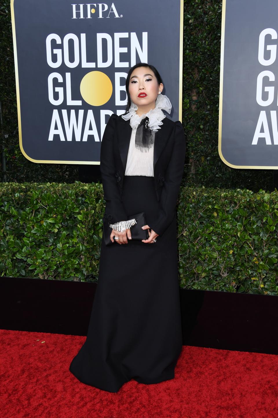 <h1 class="title">Awkwafina in Dior Haute Couture, Forevermark jewelry, and Stuart Weitzman shoes with a Jimmy Choo clutch</h1><cite class="credit">Photo: Getty Images</cite>