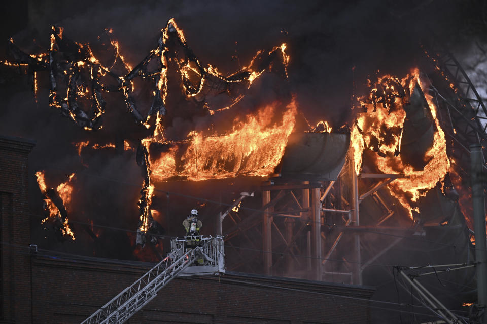 Smoke rises after a fire broke out at the Liseberg amusement park's new water world Oceana in Goteborg, Sweden, Monday Feb. 12, 2024. A fire raged through a water park attraction with several slides in the Nordic region’s largest fun fair with a huge plume of black smoke drifting over Goteborg, Sweden’s second largest city. Authorities, including the police and fire fighters, could not say whether there were any casualties. (Björn Larsson Rosvall/TT News Agency via AP)