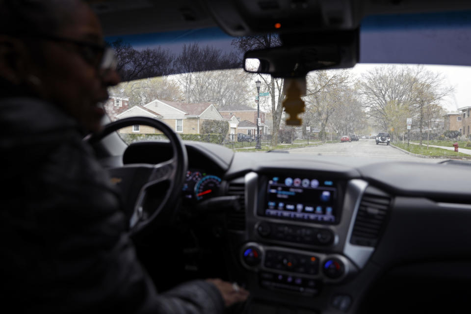 Kimberly Ross-Holmes drives through Evanston fifth ward, where she spent her childhood, Friday, April 23, 2021. The Chicago suburb will become the first to pay reparations in the form of housing grants. She said she is glad that Juneteenth will be a federal holiday, but hopes that the federal government takes up more issues that affect the everyday lives of Black people. (AP Photo/Shafkat Anowar)