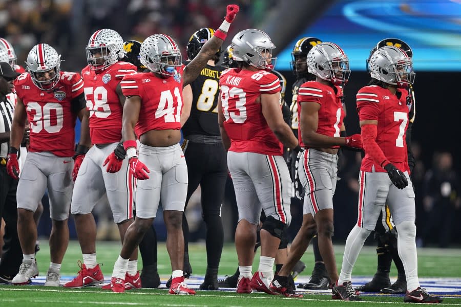 ARLINGTON, TEXAS – DECEMBER 29: Josh Proctor #41 of the Ohio State Buckeyes celebrates after a defensive stop during the second quarter against the Missouri Tigers in the Goodyear Cotton Bowl at AT&T Stadium on December 29, 2023 in Arlington, Texas. (Photo by Sam Hodde/Getty Images)