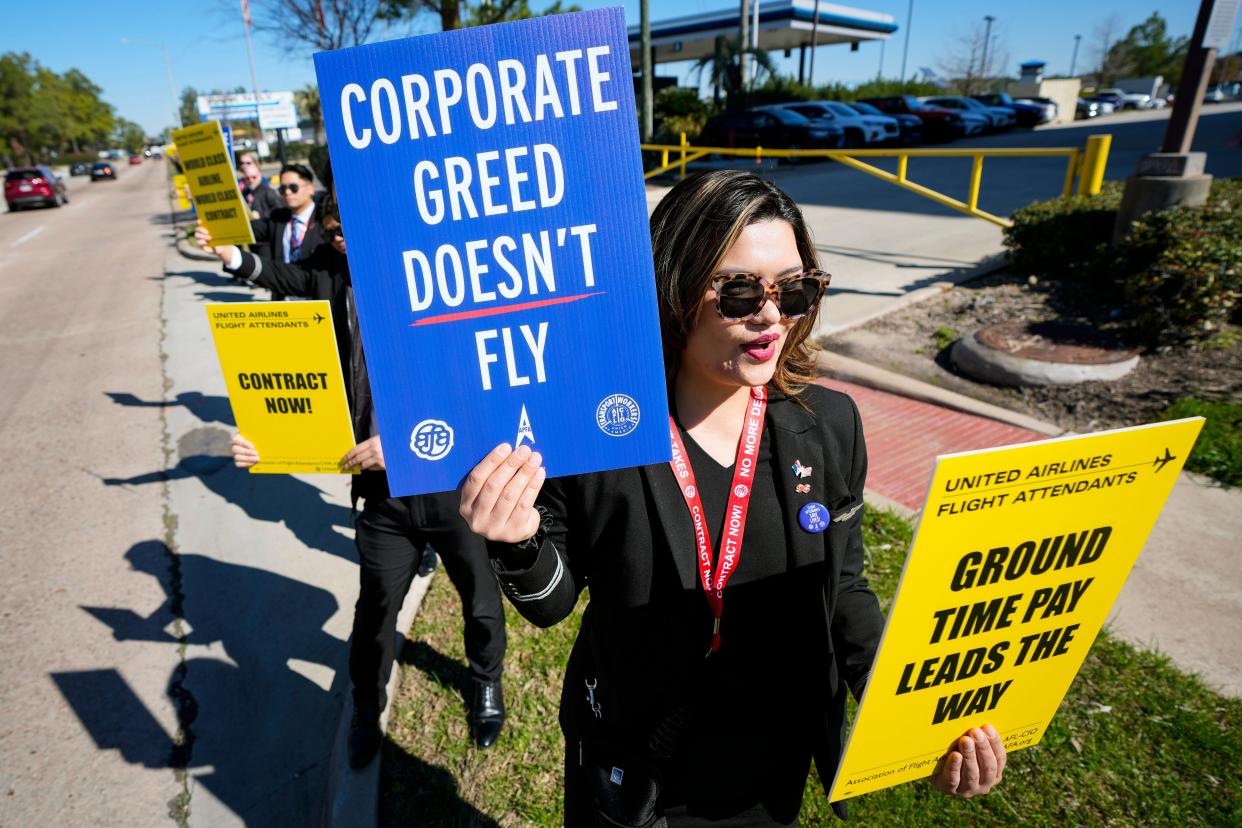 Flight attendants from several airlines lined JFK Boulevard near George Bush Intercontinental Airport picketing for fair contract negotiations on Tuesday, Feb. 13, 2024 in Houston.