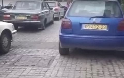 Screen capture from video footage in Amman, Jordan, reportedly showing cars with Israeli license plates as part of the production of a Netflix project  - Credit: YouTube