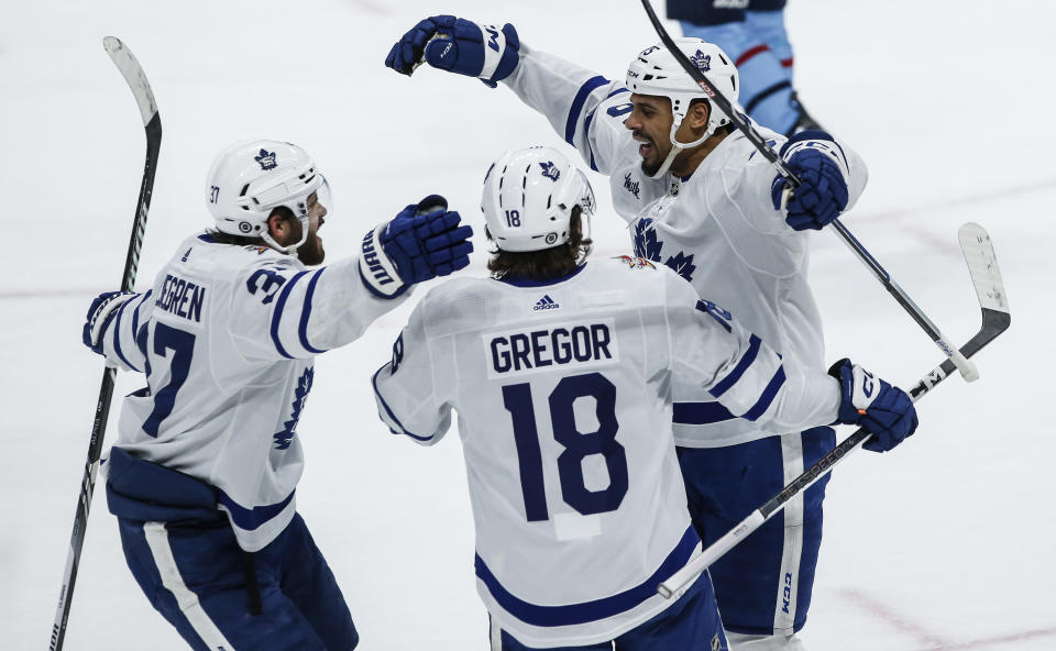 Toronto Maple Leafs' Timothy Liljegren (37), Noah Gregor (18) and Ryan Reaves (75) celebrate Reaves' goal against the Winnipeg Jets during the first period of an NHL hockey game, Saturday, Jan. 27, 2024, in Winnipeg, Manitoba. (John Woods/The Canadian Press via AP)