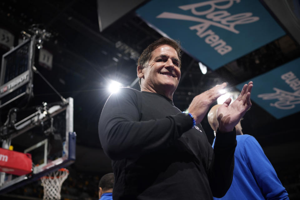 Dallas Mavericks owner Mark Cuban applauds as Mavericks are introduced for an NBA basketball in-season tournament game against the Denver Nuggets on Friday, Nov. 3, 2023, in Denver. (AP Photo/David Zalubowski)