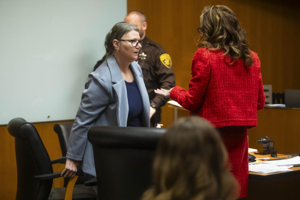 Defendant Jennifer Crumbley, left, enters the courtroom for her trial at the Oakland County Courthouse on Wednesday, Jan. 31, 2024, in Pontiac, Mich. Crumbley is charged with involuntary manslaughter. (Katy Kildee/Detroit News via AP, Pool)