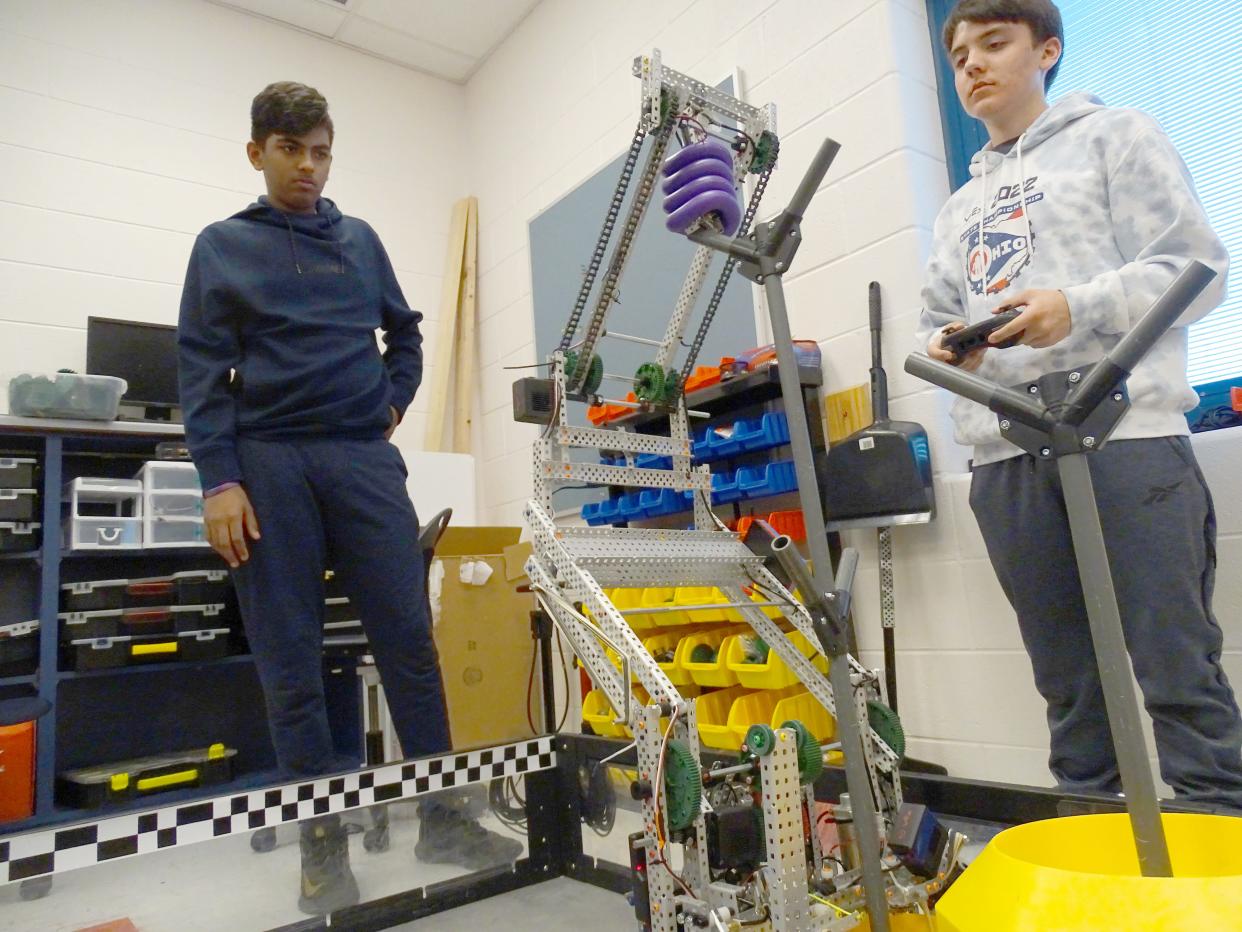 Dhruv Patel and Karter Bludnick practice for the VEX World Robotics Championship. The team leaves today for Texas for the tournament, which begins on Thursday.