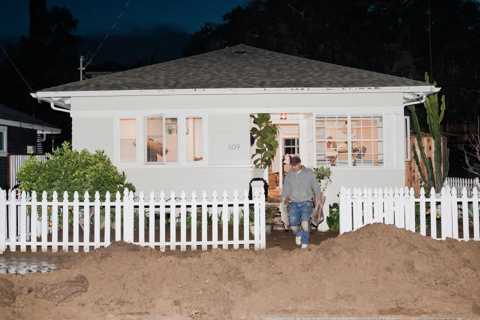 The cleanup of a damaged house in the aftermath of flooding on Bath Street in Santa Barbara on Jan. 10.<span class="copyright">Alex Welsh for TIME</span>