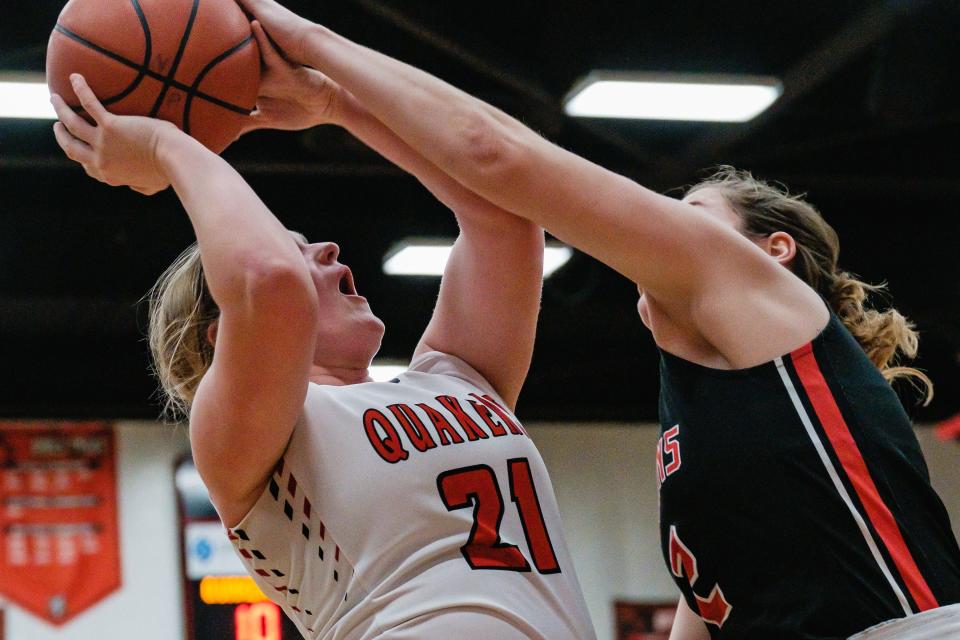 New Philadelphia's Ellie Mason is fouled by Tusky Valley's Kadence Stutz, Wednesday, Feb. 8.