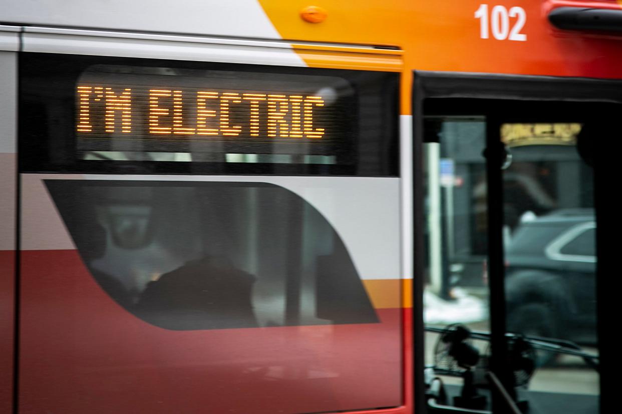 The digital display on an Iowa City Transit Proterra ZX5 electric bus on the Downtown Free Shuttle route reads "I'm electric," Monday, Jan. 24, 2022, in Iowa City, Iowa.