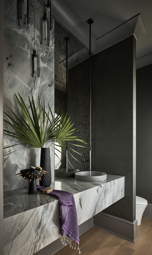 a bathroom with a sink and a plant