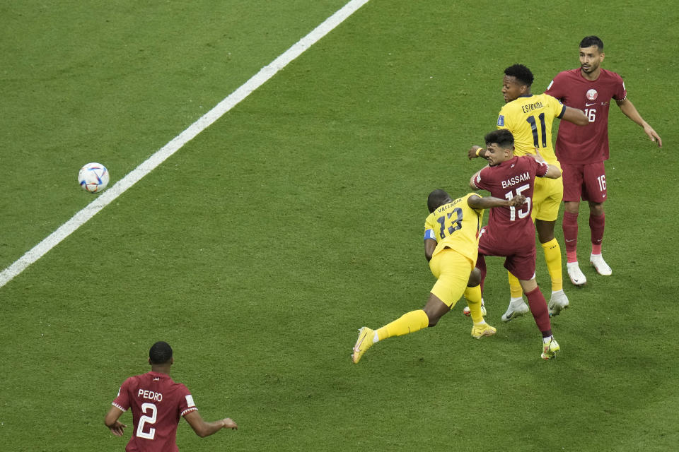 Ecuador's Enner Valencia, centre bottom, scores his side's second goal during the World Cup group A soccer match between Qatar and Ecuador at the Al Bayt Stadium in Al Khor, Qatar, Sunday, Nov. 20, 2022. (AP Photo/Hassan Ammar)