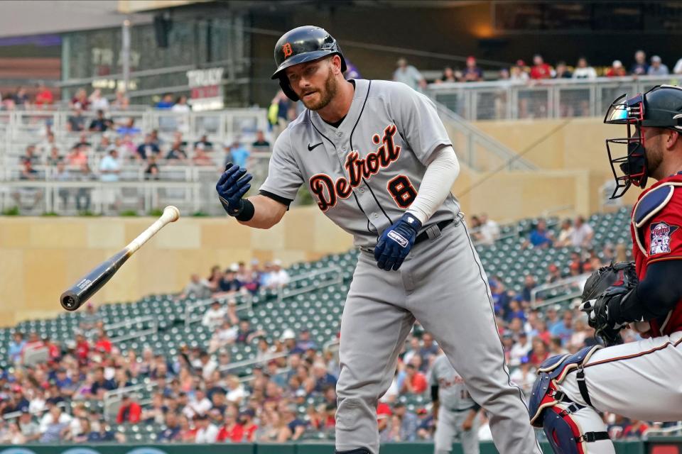 Detroit Tigers' Robbie Grossman (8) tosses his bat after he drew a walk off Minnesota Twins pitcher Kenta Maeda during the first inning of a baseball game Tuesday, July 27, 2021, in Minneapolis.