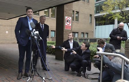 Former New Zealand cricket captain Chris Cairns speaks to members of the media outside Southwark Crown Court in London, Britain November 30, 2015. REUTERS/Philip Brown