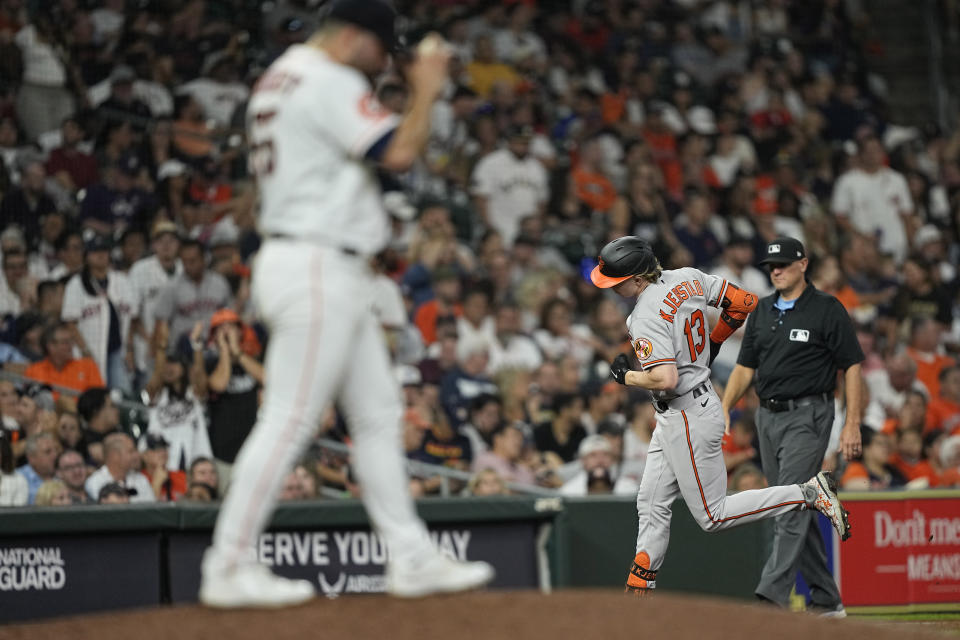 Baltimore Orioles' Heston Kjerstad (13) runs the bases after hitting a home run off Houston Astros pitcher Jose Urquidy, left, during the seventh inning of a baseball game Tuesday, Sept. 19, 2023, in Houston. (AP Photo/David J. Phillip)