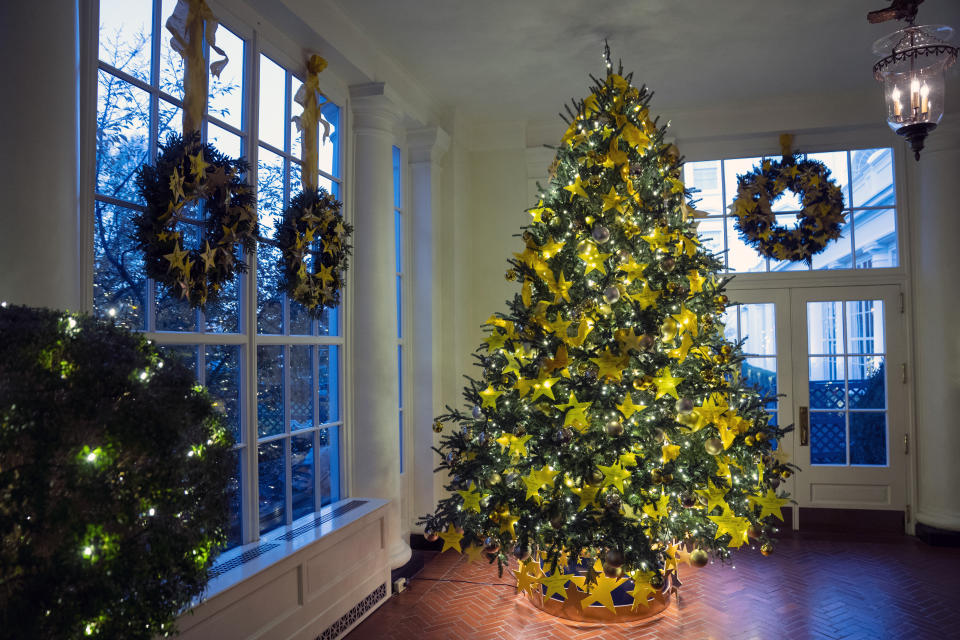 The Gold Star Tree sits in the East Landing of the White House during a preview of the White House holiday decorations, Monday, Nov. 29, 2021, in Washington. (AP Photo/Evan Vucci)