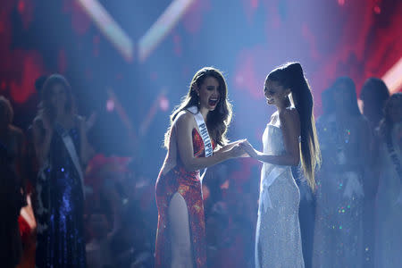 Miss Philippines Catriona Gray reacts after she is named the winner as she hold hands with first runner-up Miss South Africa Tamaryn Green during the final round of the Miss Universe pageant in Bangkok, Thailand, December 17, 2018. REUTERS/Athit Perawongmetha