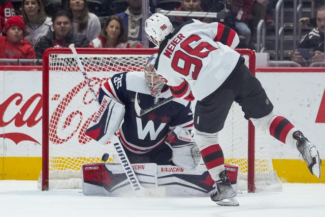 New Jersey Devils right wing Timo Meier (96) scores the game-winning goal past Washington Capitals goaltender Darcy Kuemper (35) during a shootout of an NHL hockey game, Thursday, March 9, 2023, in Washington. The Devils won 3-2 in a shootout. (AP Photo/Alex Brandon)
