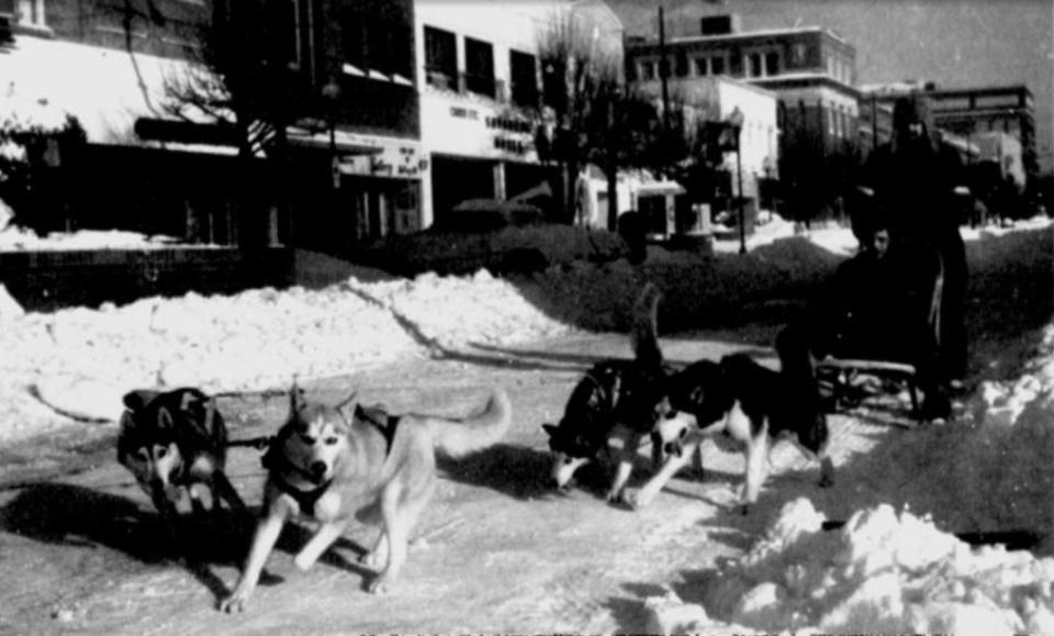 In this file photo, Terry Kirby and his son, Terry Kirby Jr., take their team of malamutes out for a ride on Main Street on March 14, 1993.