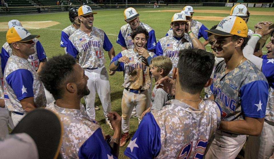 Leesburg Lightning players celebrate after winning Game 2 of the FCSL Championship against the Winter Park Diamond Dawgs at Pat Thomas Stadium-Buddy Lowe Field on July 30, 2022. Leesburg won 6-5 after 13 innings.