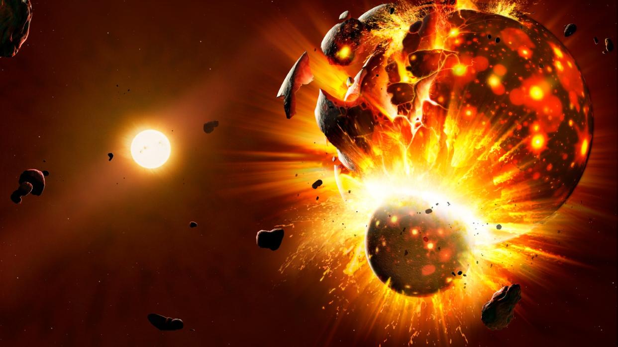  A spherical body crashes into a larger one in space, creating a massive explosion of fire and chunks of planet. 