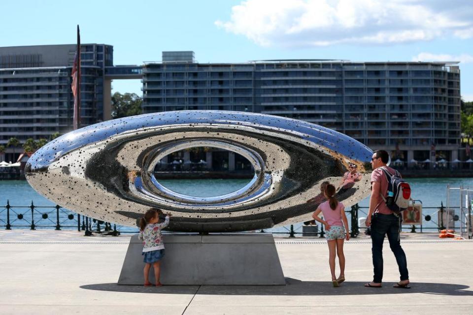 People interact with Lindy Lee’s new public artwork, Secret World of a Starlight Ember at Museum of Contemporary in Sydney.