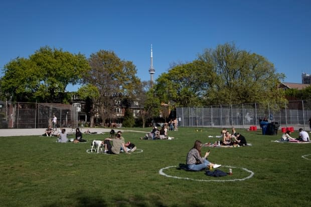 There are already signs another distanced summer is in store for Toronto, like the freshly painted circles at Trinity Bellwoods Park in the city's west end.  (Evan Mitsui/CBC - image credit)