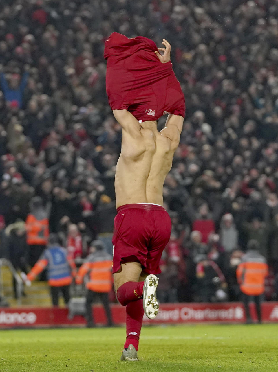 Liverpool's Mohamed Salah celebrates after scoring his side's second goal during the English Premier League soccer match between Liverpool and Manchester United at Anfield Stadium in Liverpool, Sunday, Jan. 19, 2020.(AP Photo/Jon Super)