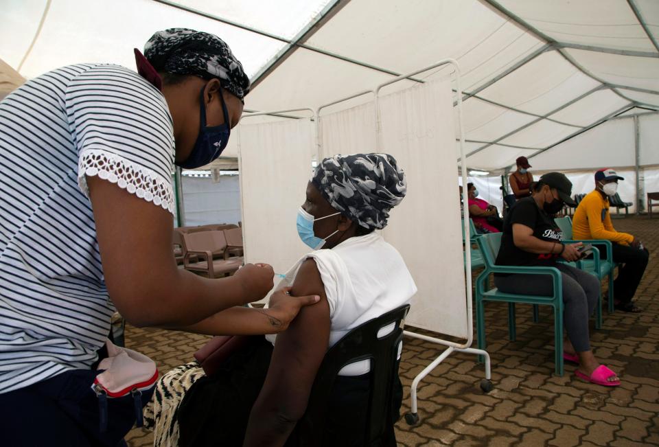 Giving a COVID-19 vaccine in Soweto, South Africa, on Nov. 29, 2021.