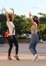 <p>Kaley Cuoco and sister Briana goof around striking playful poses together while on a walk around New York City on Sunday. </p>