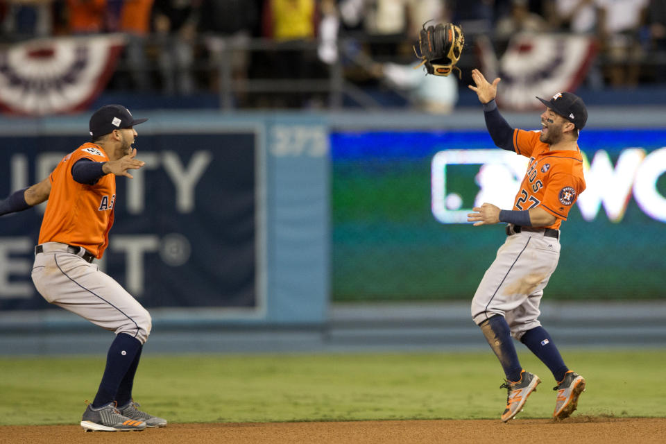 <p>Jose Altuve #27 and Carlos Correa #1 of the Houston Astros celebrate on the field after the Astros defeated the Los Angeles Dodgers in Game 7 of the 2017 World Series at Dodger Stadium on Wednesday, November 1, 2017 in Los Angeles, California. (Photo by Rob Tringali/MLB Photos via Getty Images) </p>