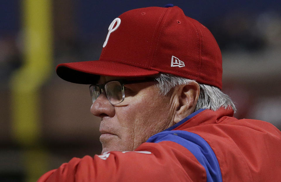 In this Aug. 17, 2017 photo, Philadelphia Phillies manager Pete Mackanin watches from the dugout before a baseball game against the San Francisco Giants in San Francisco. (AP Photo/Jeff Chiu)