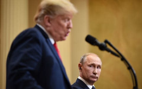 Donald Trump takes to the stand at the press conference - Credit: AFP