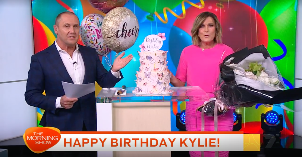 The Morning Show’s Larry Emdur and Kylie Gillies with her birthday cake.