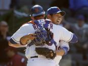 New York Mets relief pitcher Daisuke Matsuzaka smiles as he embraces catcher Anthony Recker after earning his first save since the 2000 season in Japan, after closing out the Mets' 4-1 victory over the St. Louis Cardinals in a baseball game in New York, Thursday, April 24, 2014. (AP Photo/Kathy Willens)