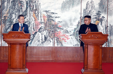 South Korean President Moon Jae-in shakes hands with North Korean leader Kim Jong Un attend a joint press conference in Pyongyang, North Korea, September 19, 2018. Pyeongyang Press Corps/Pool via REUTERS