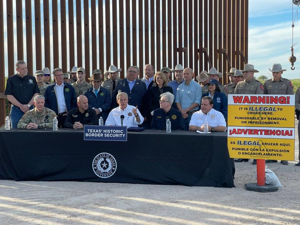 Gov. Greg Abbott and Republican lawmakers gather for a bill signing ceremony in Brownsville, giving final approval to SB 4 and additional border security legislation.