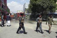 Afghan Security Police arrives at the site of explosions in Kabul, Afghanistan, Sunday, June 2, 2019. Afghan officials say there have been three explosions in the capital, Kabul, including a sticky bomb attached to a bus carrying university students. (AP Photo/Rahmat Gul)