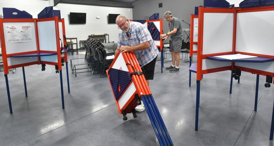 Poll worker Doug Rives helps set up voting equipment on Monday at Cross Bridge Church in Rockledge in advance of Tuesday's municipal election there. Rockledge will have one contested election on the City Council, with incumbent Sammie Brown Martin facing Josiah Gattle for Seat 3. Polls are open 7 a.m. to 7 p.m.